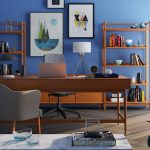 Brown Wooden Desk With Rolling Chair And Shelves Near Window 150x150